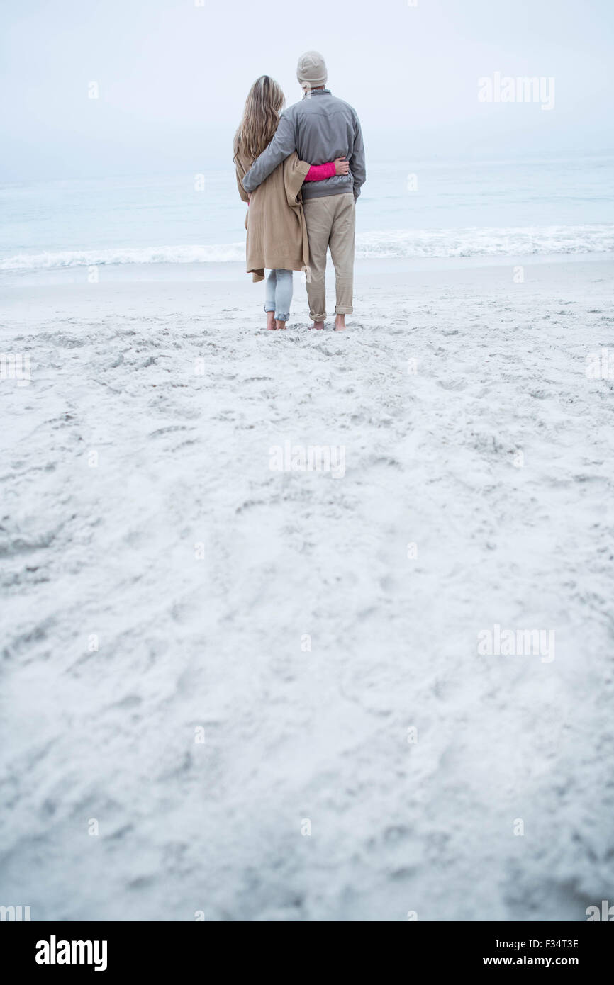 Couple walking the beach together Stock Photo - Alamy