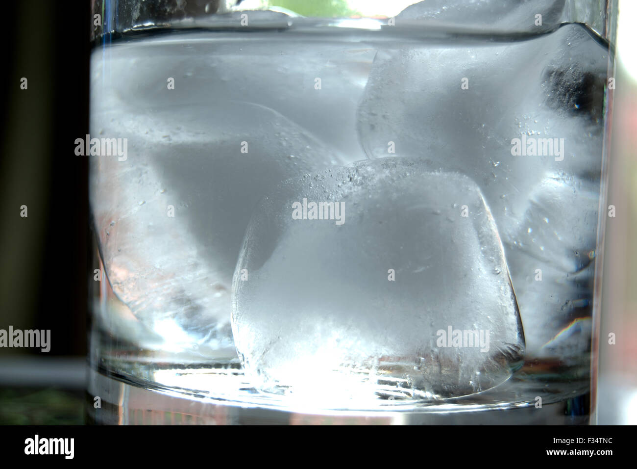 vodka and ice cubes in clear glass Stock Photo Alamy