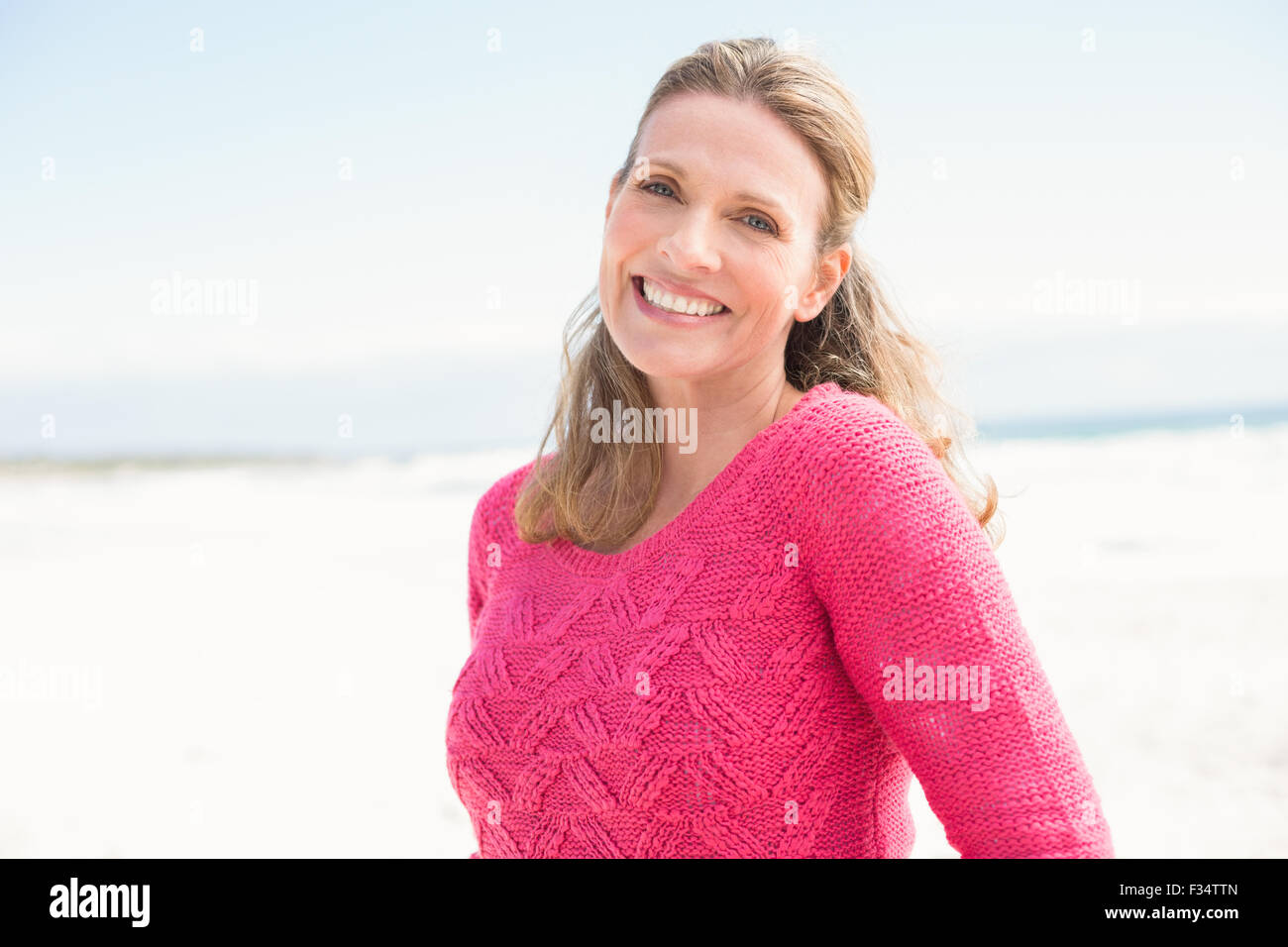 Woman in pink top wearing hi-res stock photography and images - Alamy