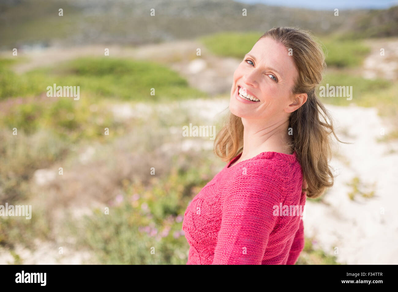 Woman in pink top wearing hi-res stock photography and images - Alamy