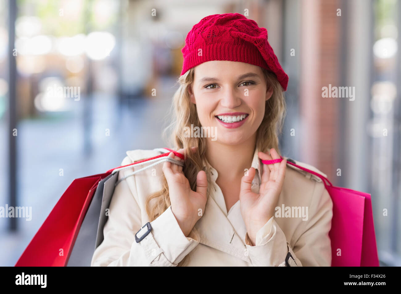 Portrait of a happy smiling woman with shopping bags Stock Photo - Alamy