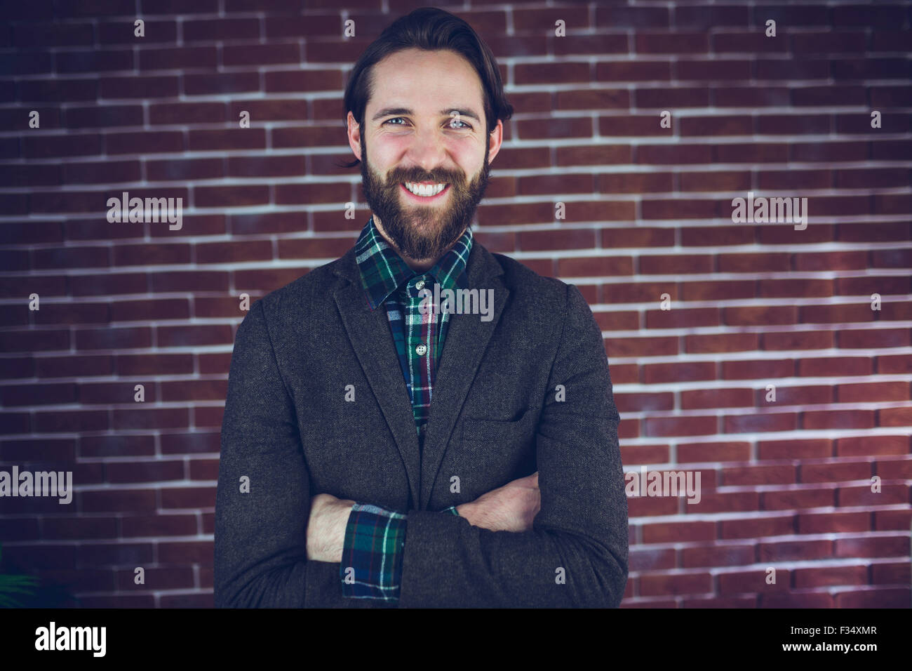 Happy man with arms crossed hi-res stock photography and images - Alamy