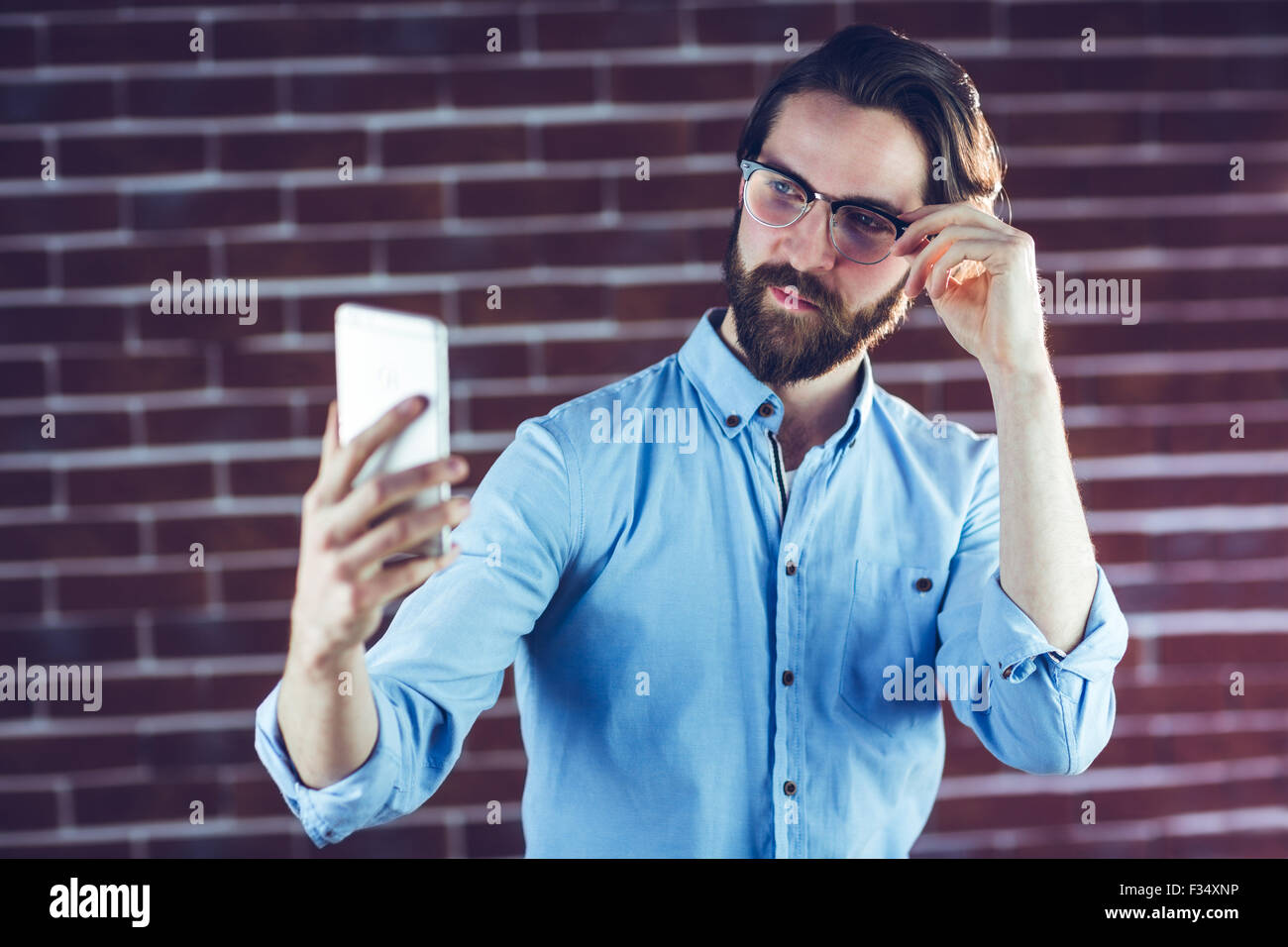 Handsome man taking picture of himself Stock Photo Alamy