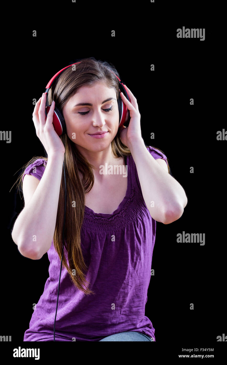 Black woman thinking headphones hi-res stock photography and images - Alamy