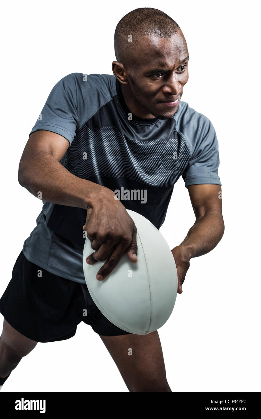 Confident athlete throwing rugby ball Stock Photo Alamy