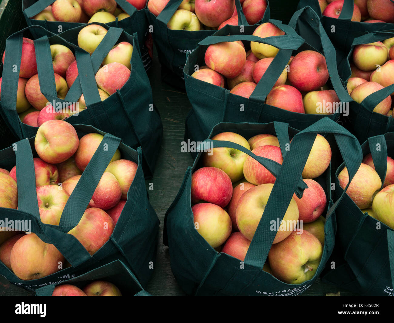 Bag of apples on display in farmers market Stock Photo Alamy
