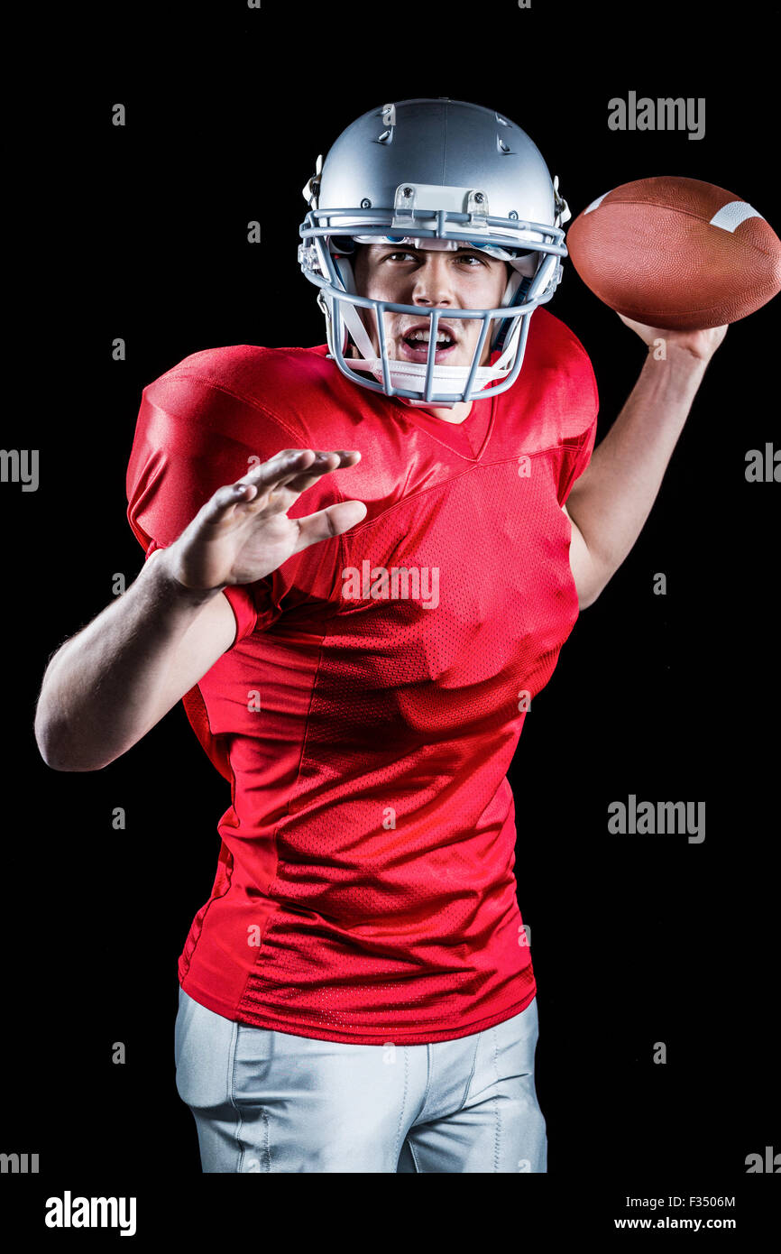 American football player throwing ball Stock Photo Alamy