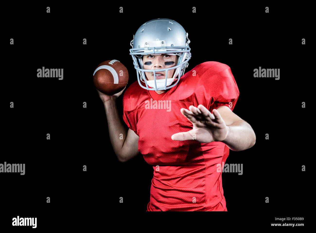 American football player throwing ball Stock Photo Alamy