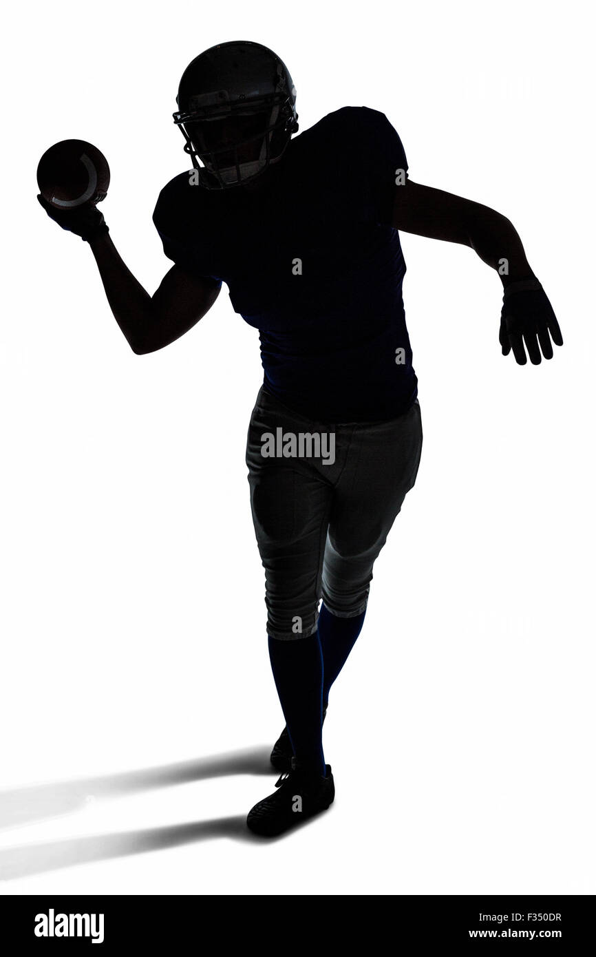 American football player throwing ball Stock Photo Alamy