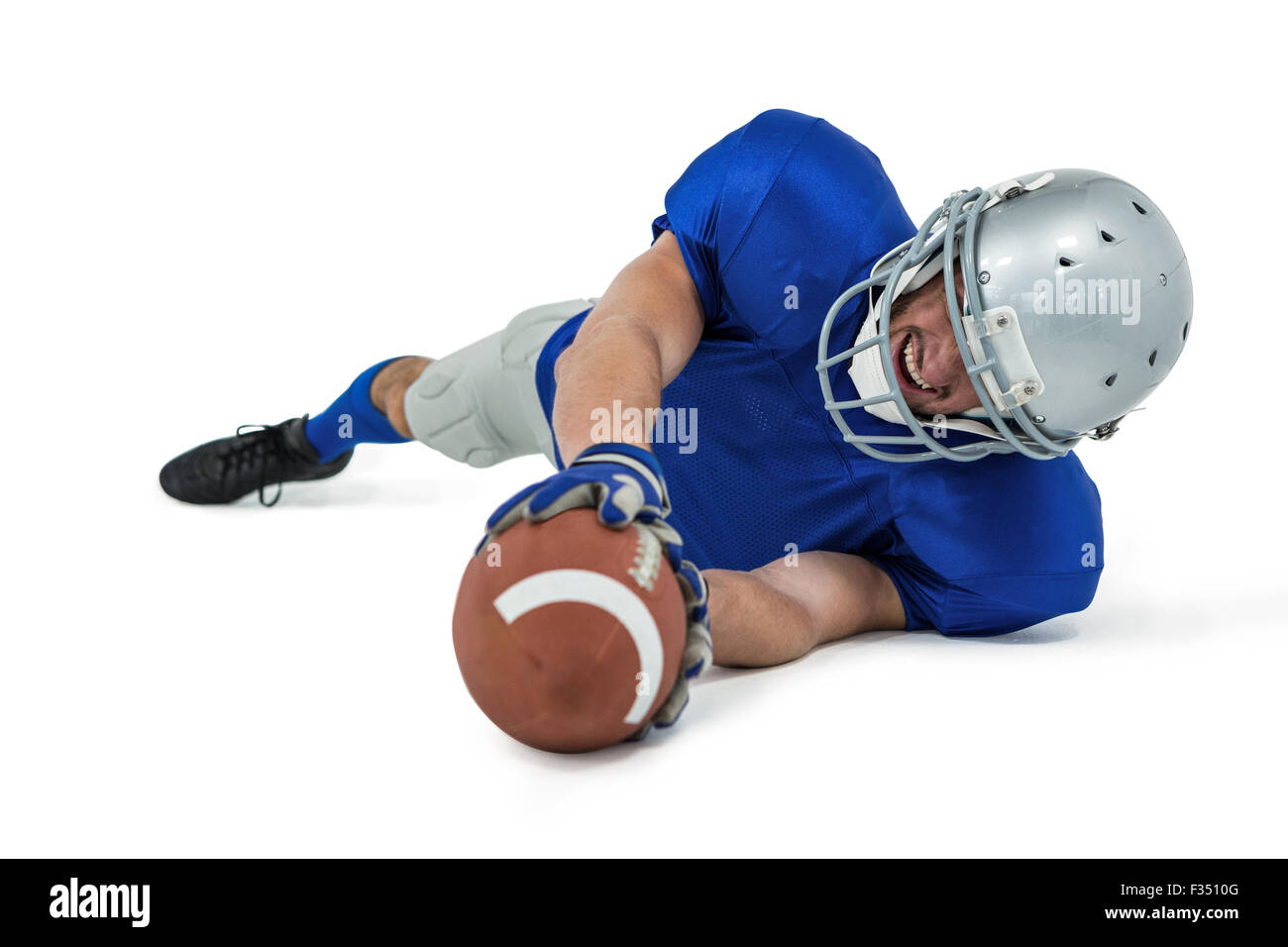 American football player reaching ball Stock Photo - Alamy