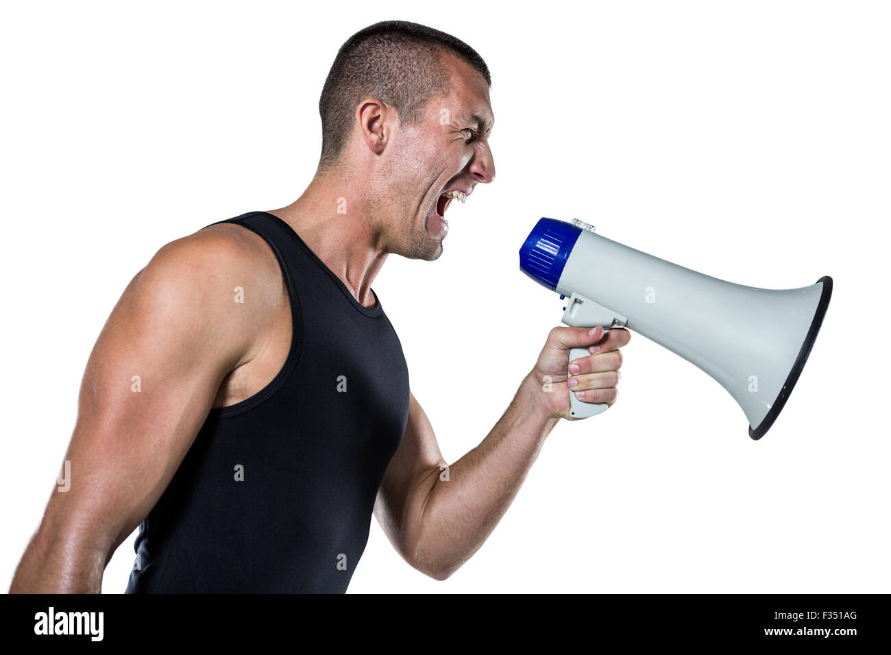 Irritated male trainer yelling through megaphone Stock Photo Alamy