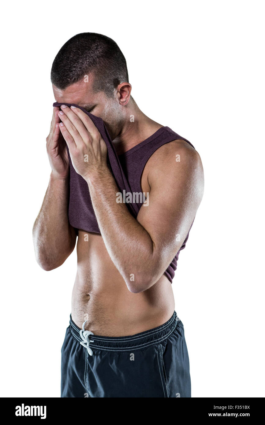 An athlete wiping sweat off his face Stock Photo