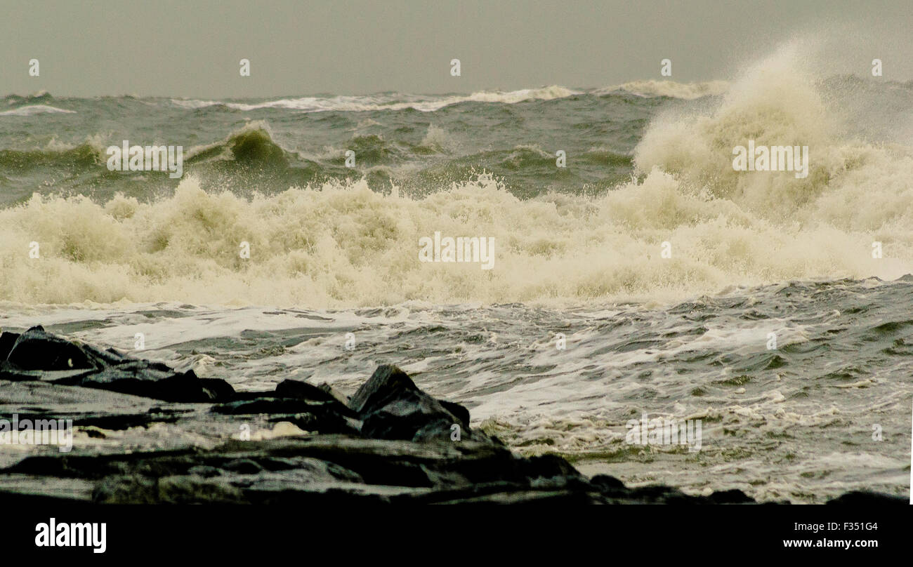 Heavy surf crashing upon the Ocean City Inlet, Jetty, after a storm Stock Photo