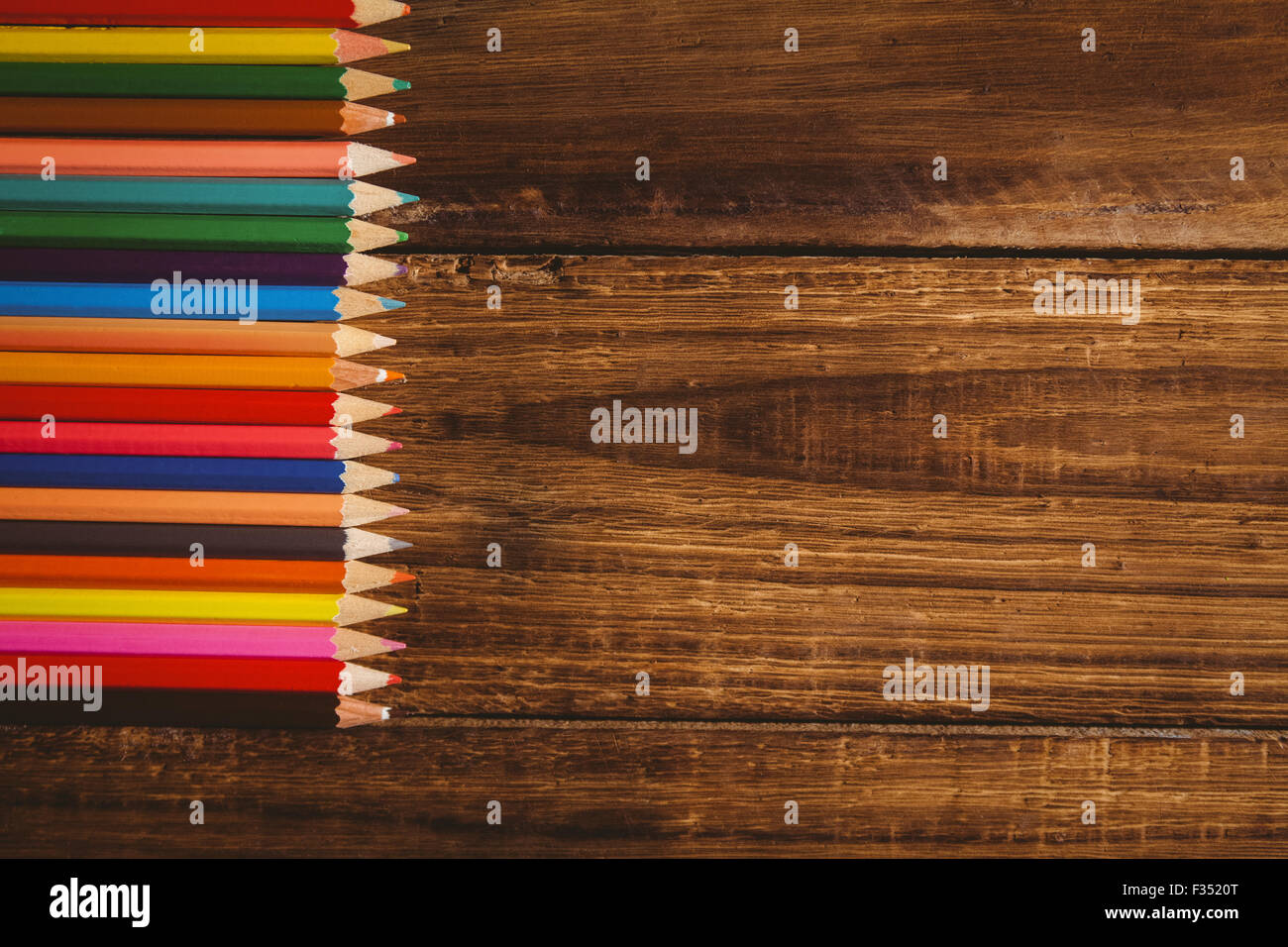 Colour pencils on table with copy space Stock Photo - Alamy