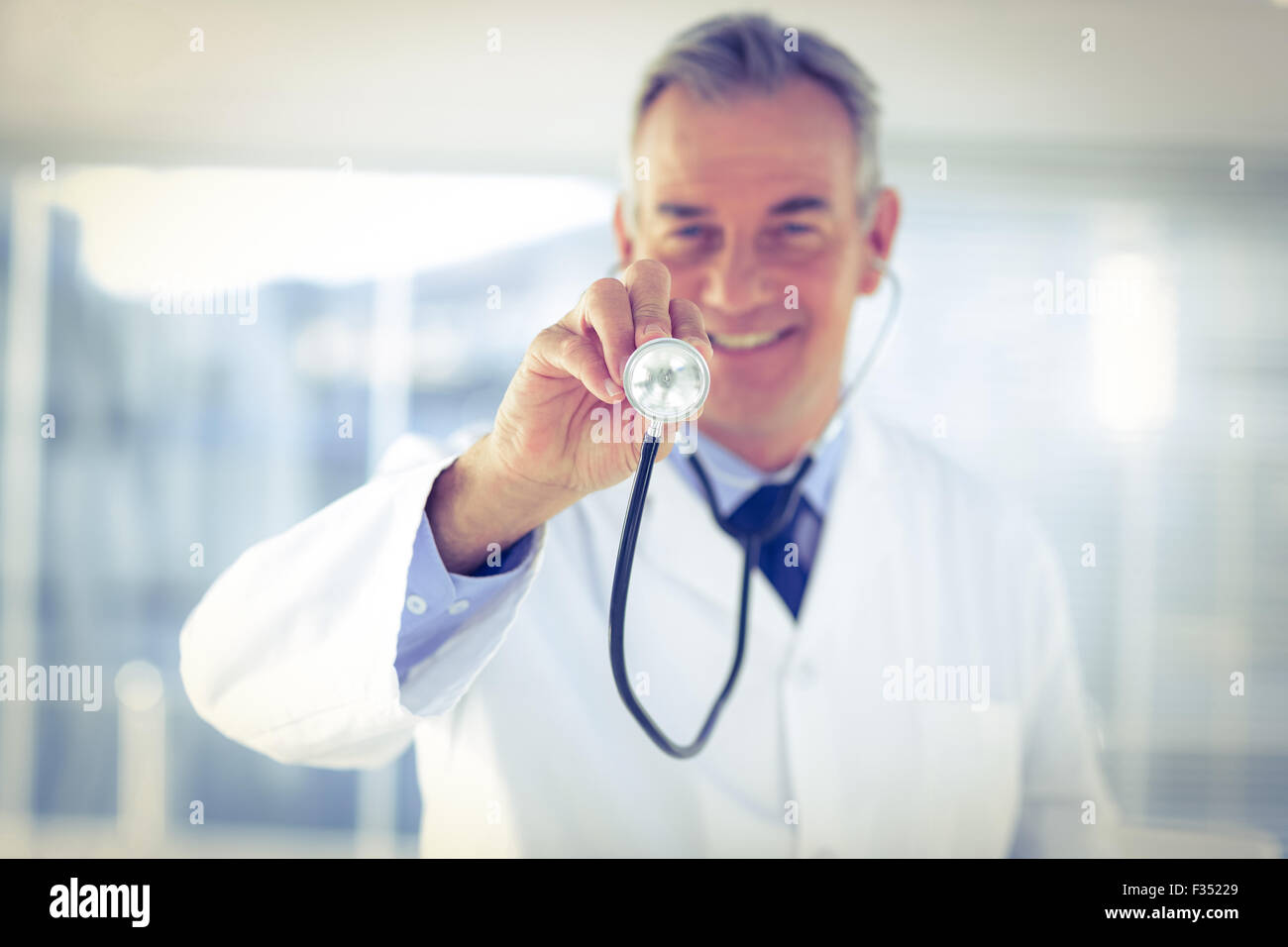 Portrait of male doctor with stethoscope in hospital Stock Photo - Alamy