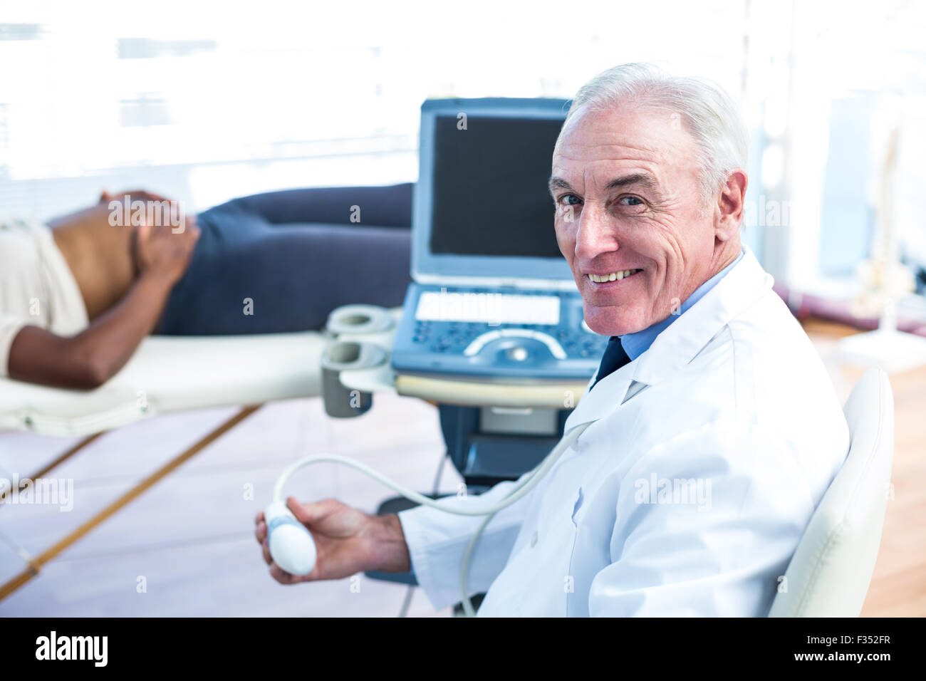 Portrait of smiling male doctor Stock Photo - Alamy