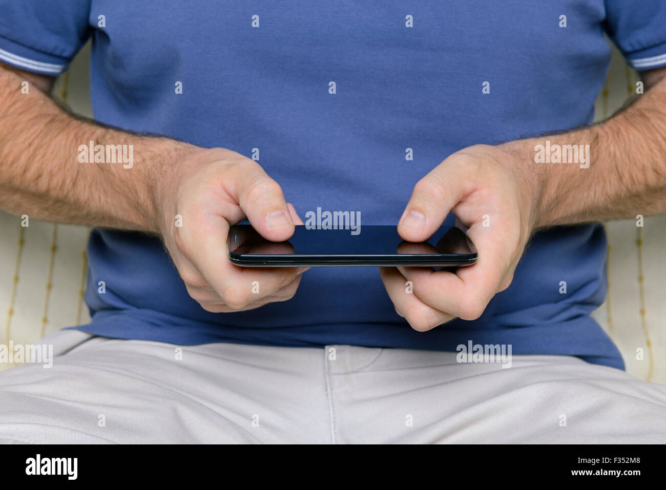 Man with a Smartphone, Close Up. Stock Photo