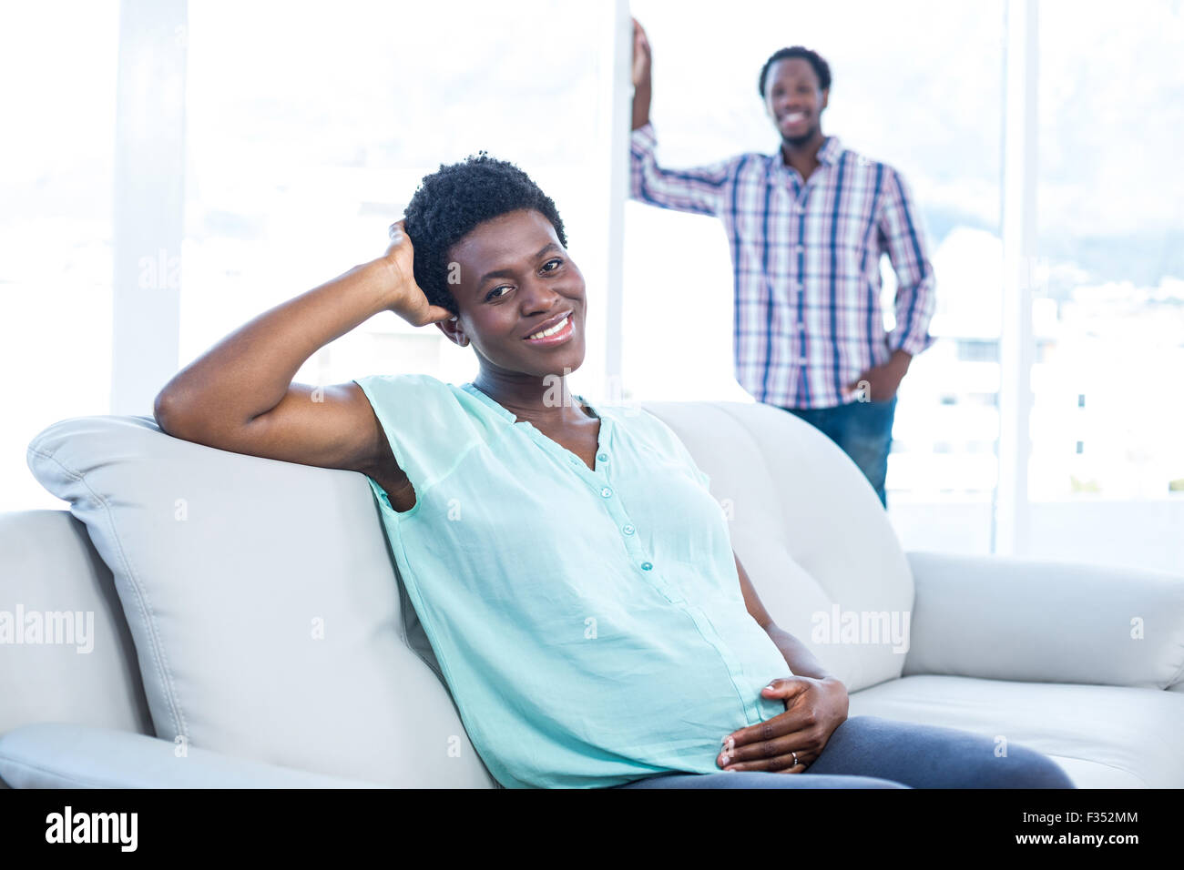Joyful black woman sitting hi-res stock photography and images - Alamy