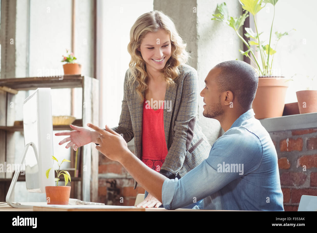 Smiling business people discussing in office Stock Photo - Alamy