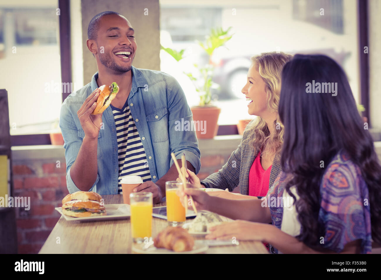 Happy business people having breakfast Stock Photo - Alamy