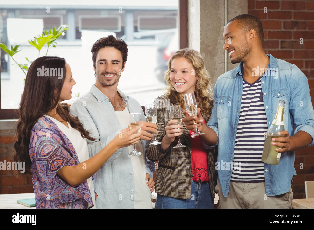 Business people toasting with champagne in office Stock Photo Alamy