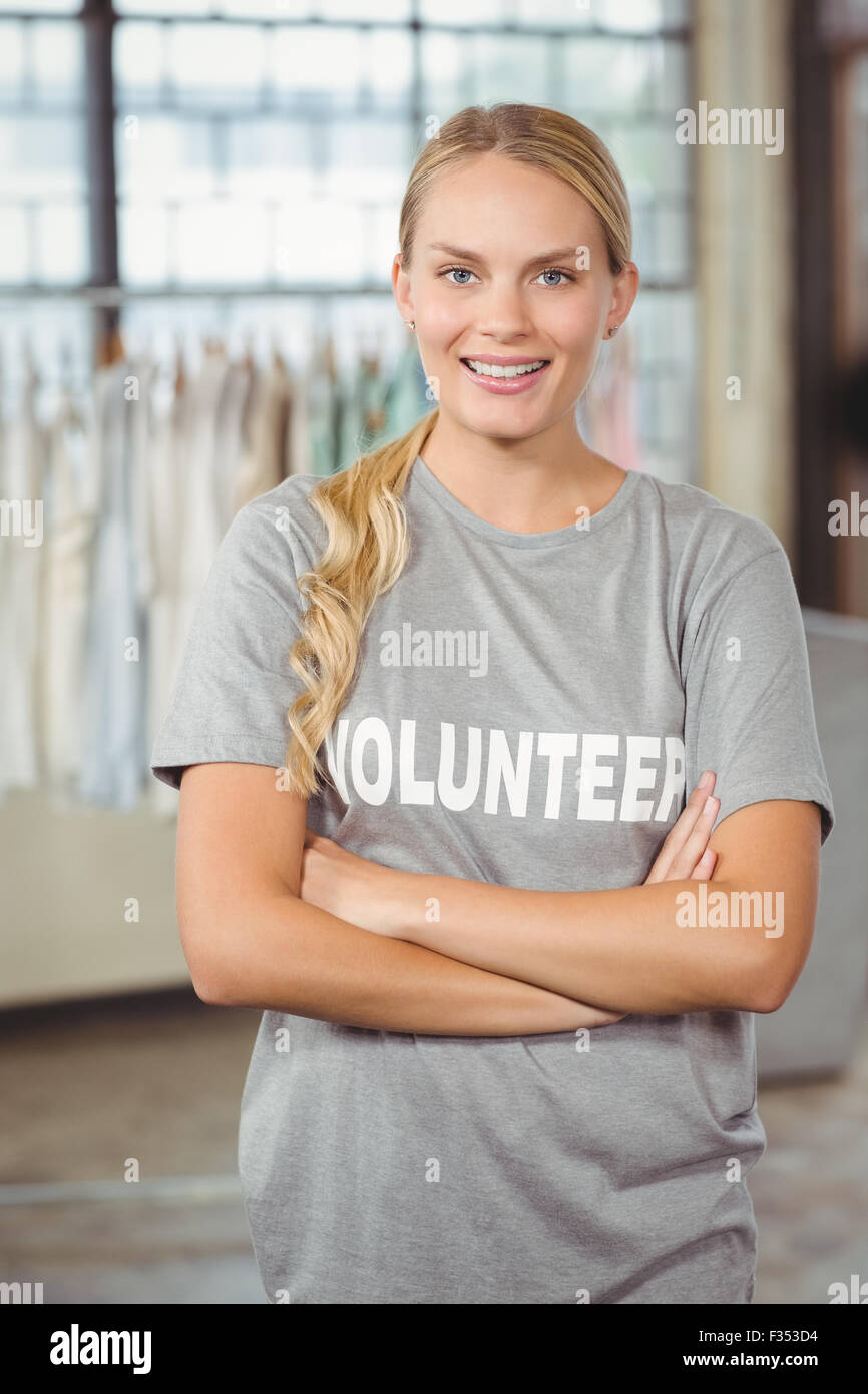Portrait of beautiful smiling woman with arms crossed Stock Photo - Alamy