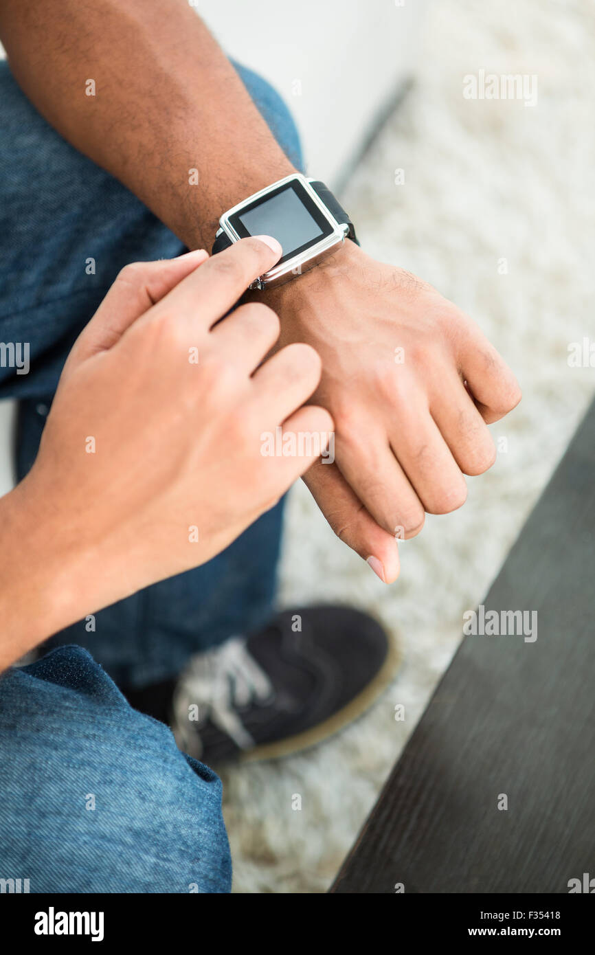 High angle view of man using smart watch Stock Photo - Alamy