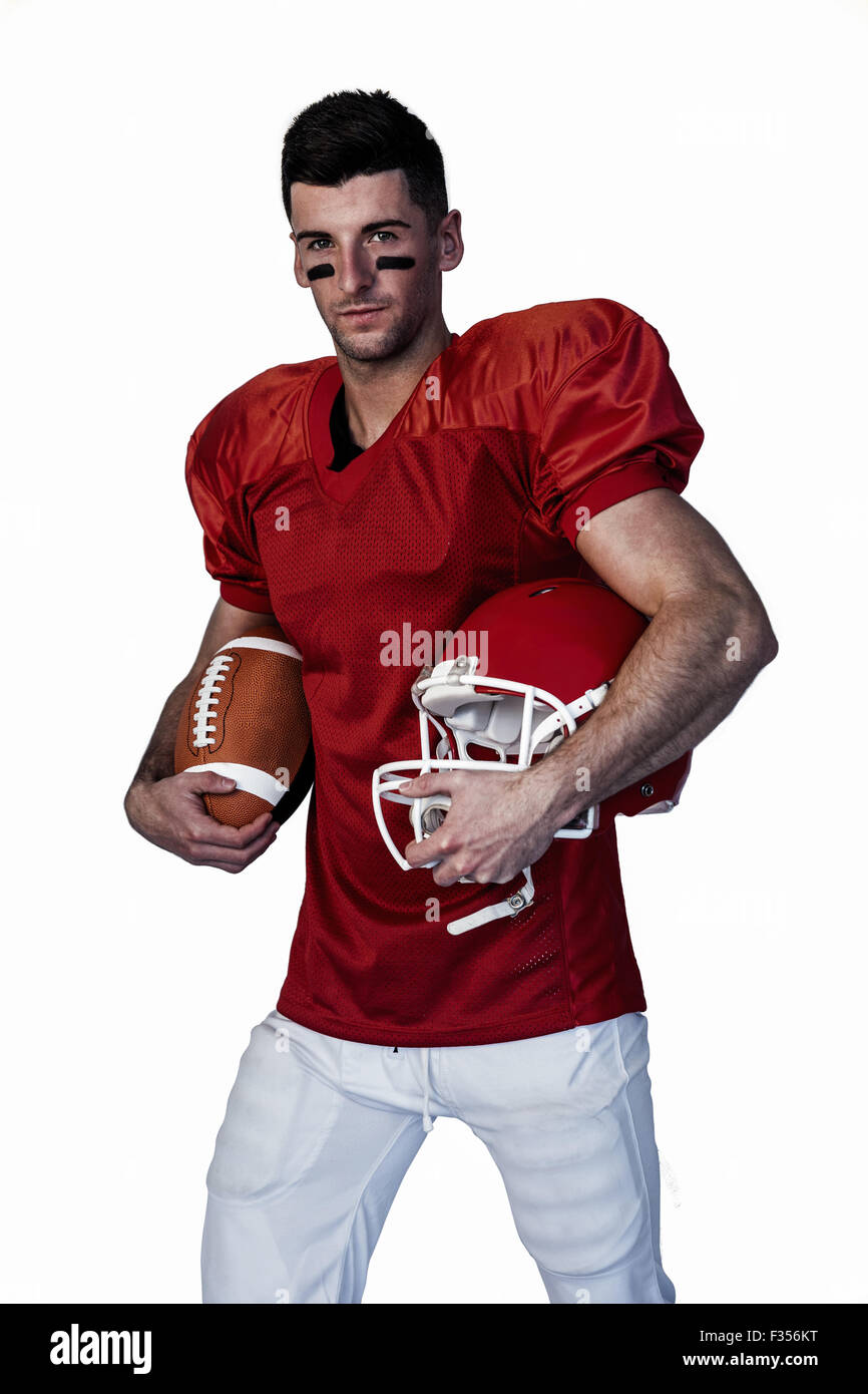 Rugby player holding ball and helmet Stock Photo Alamy