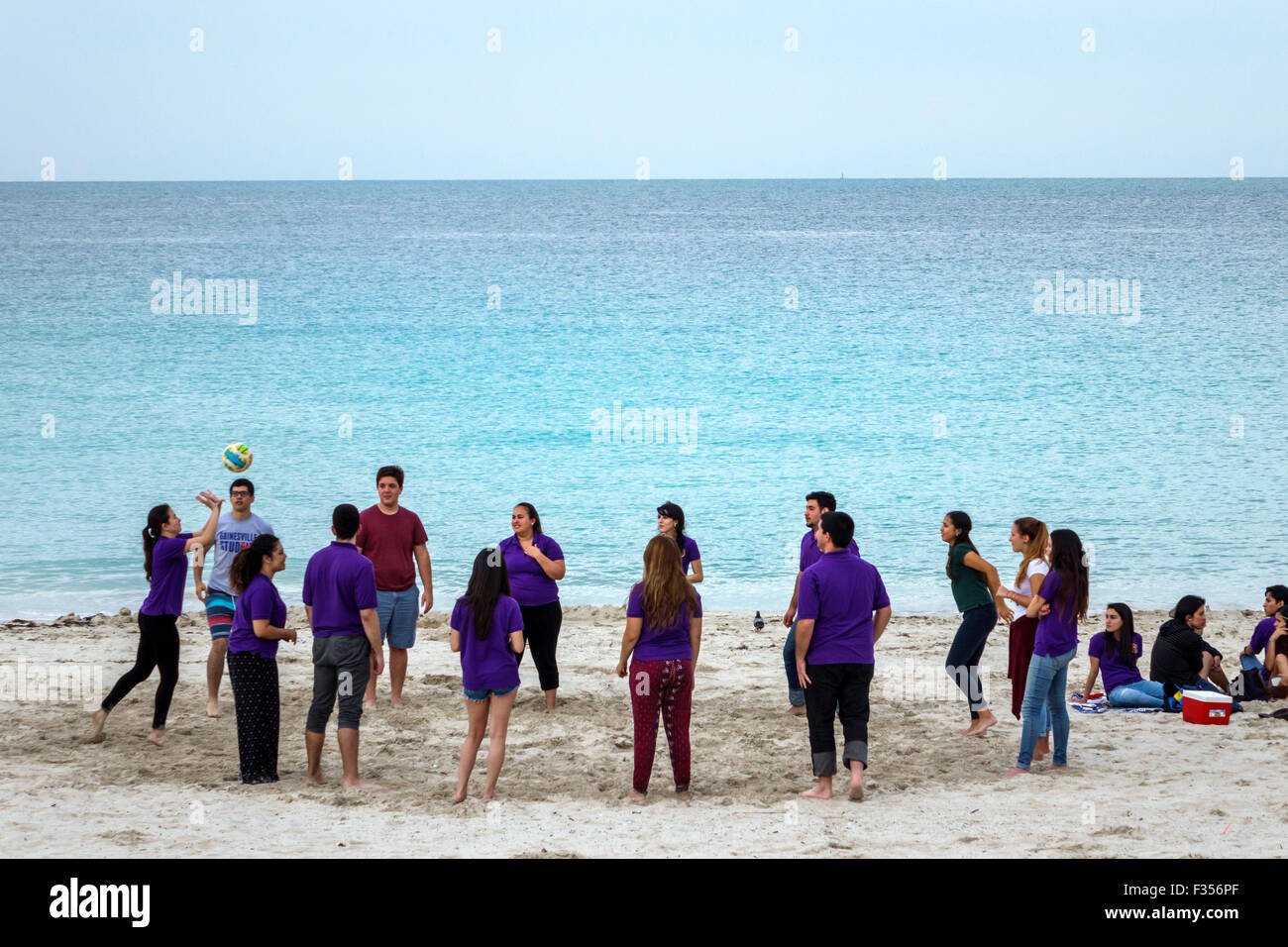 Miami Beach Florida,sand,Atlantic Ocean water,student students education pupil pupils,teen teens teenage teenager teenagers youth adolescent,Honor Soc Stock Photo