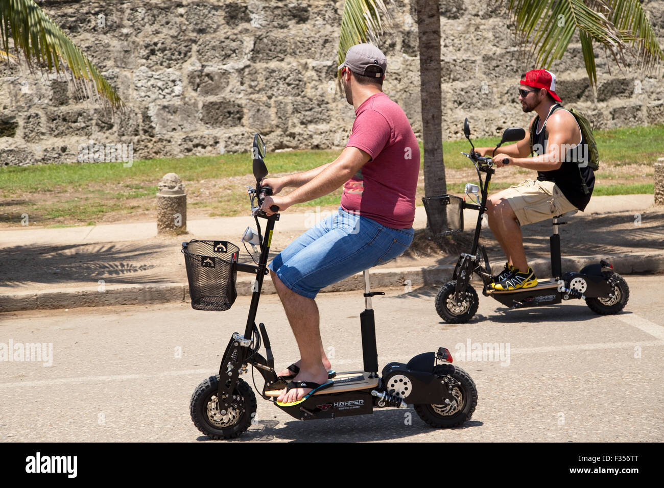 CARTAGENA - SEPTEMBER 13TH: Unidentified men with electric scooters on September the 13th, 2015 in Cartagena, Colombia. Cartagen Stock Photo