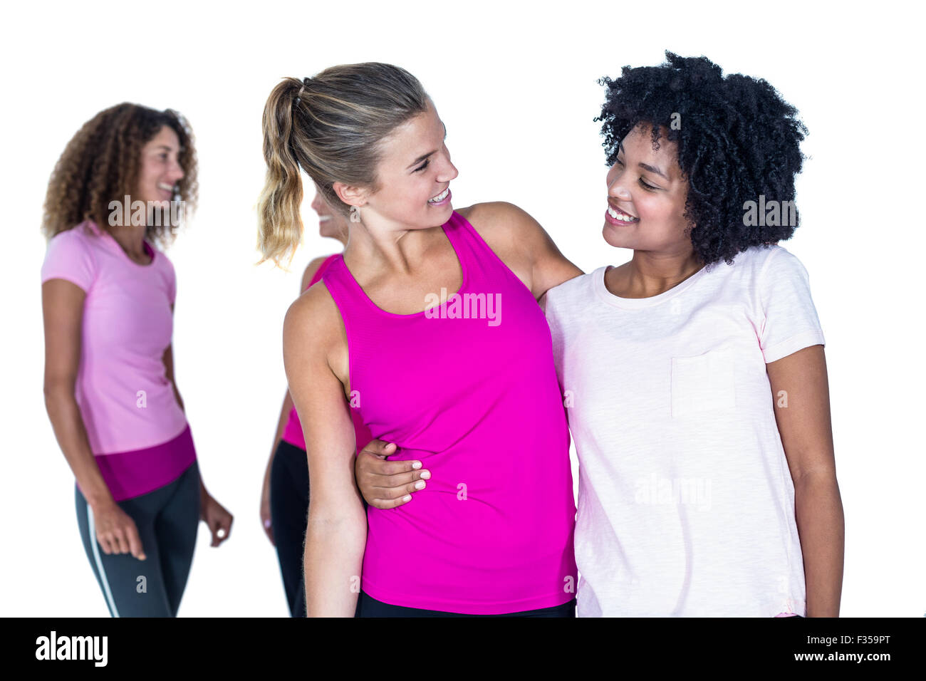 Cheerful women with arms around Stock Photo