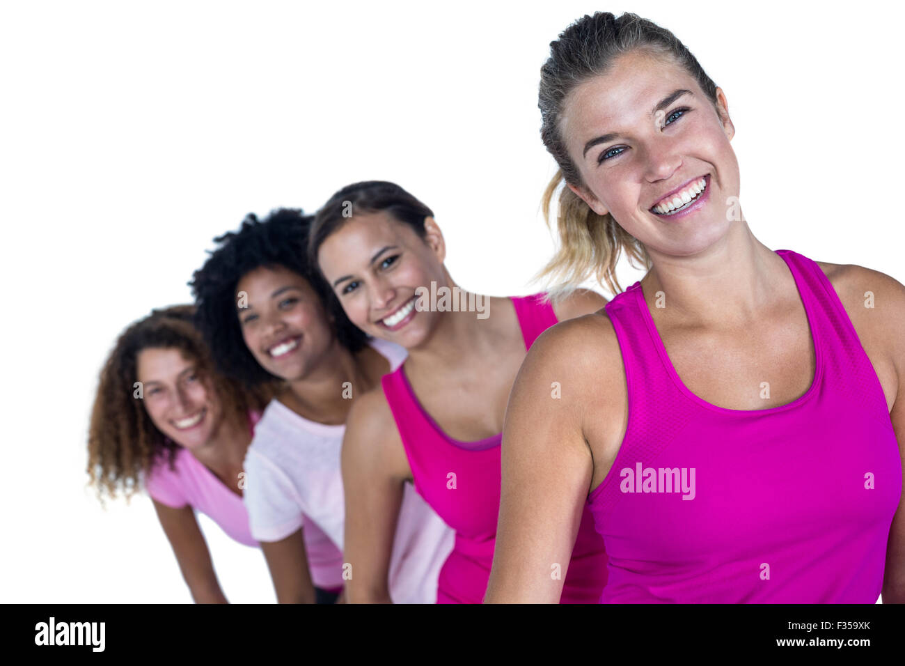 Portrait of happy women standing in row Stock Photo - Alamy