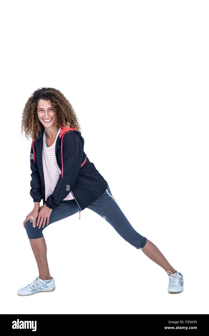 Young woman stretching knee Cut Out Stock Images & Pictures - Alamy