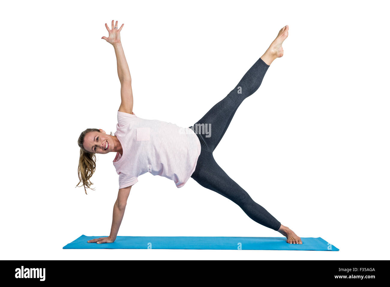 Portrait of fit woman exercising on mat Stock Photo - Alamy