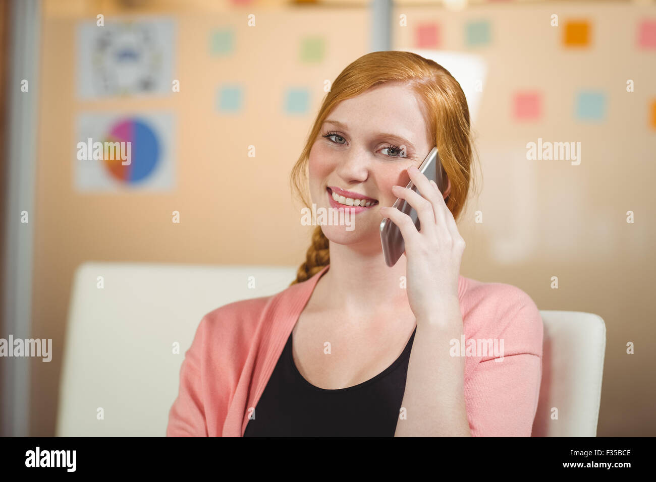 Businesswoman using phone Stock Photo