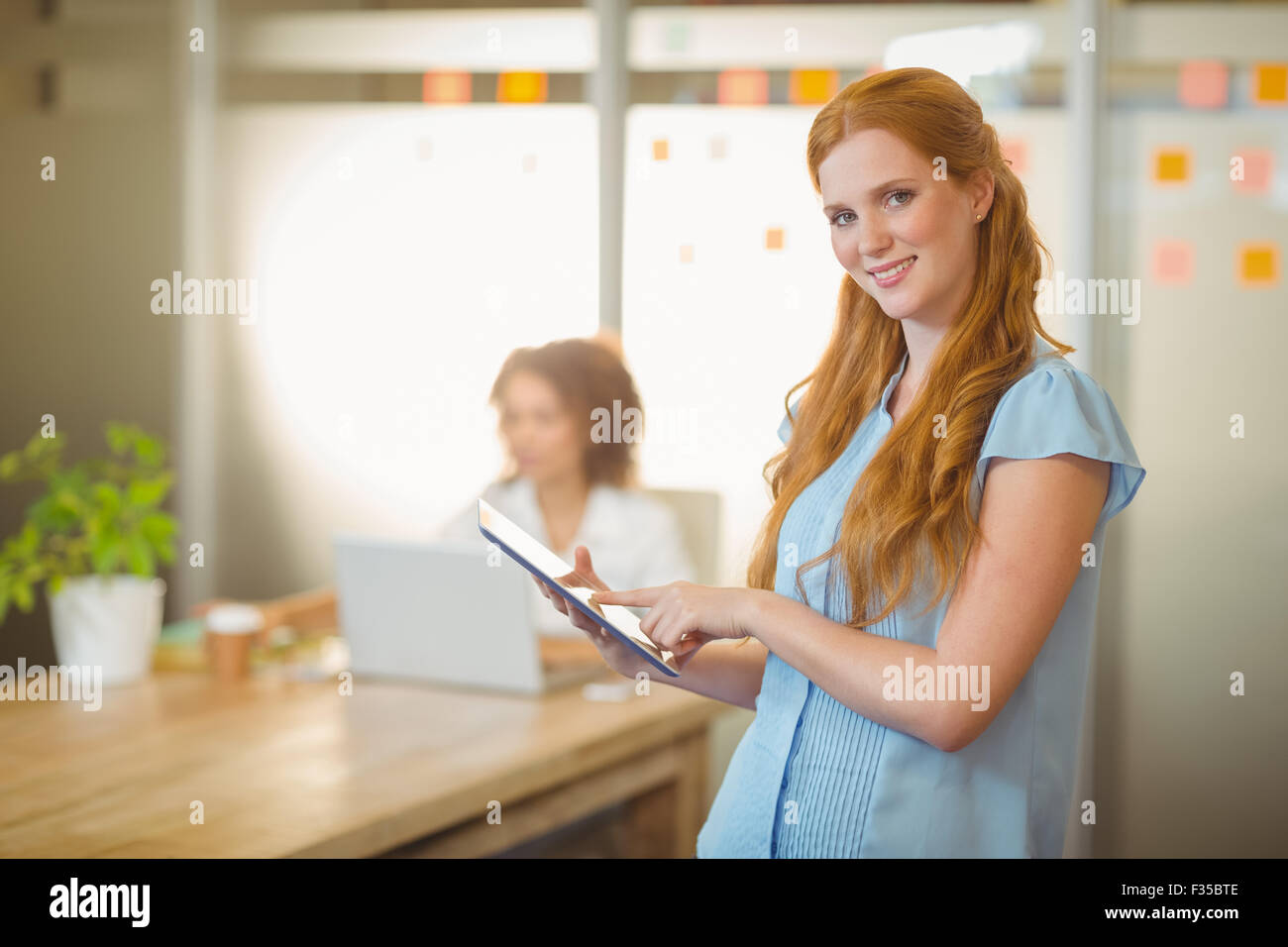 Redhead businesswoman using smart hi-res stock photography and images ...