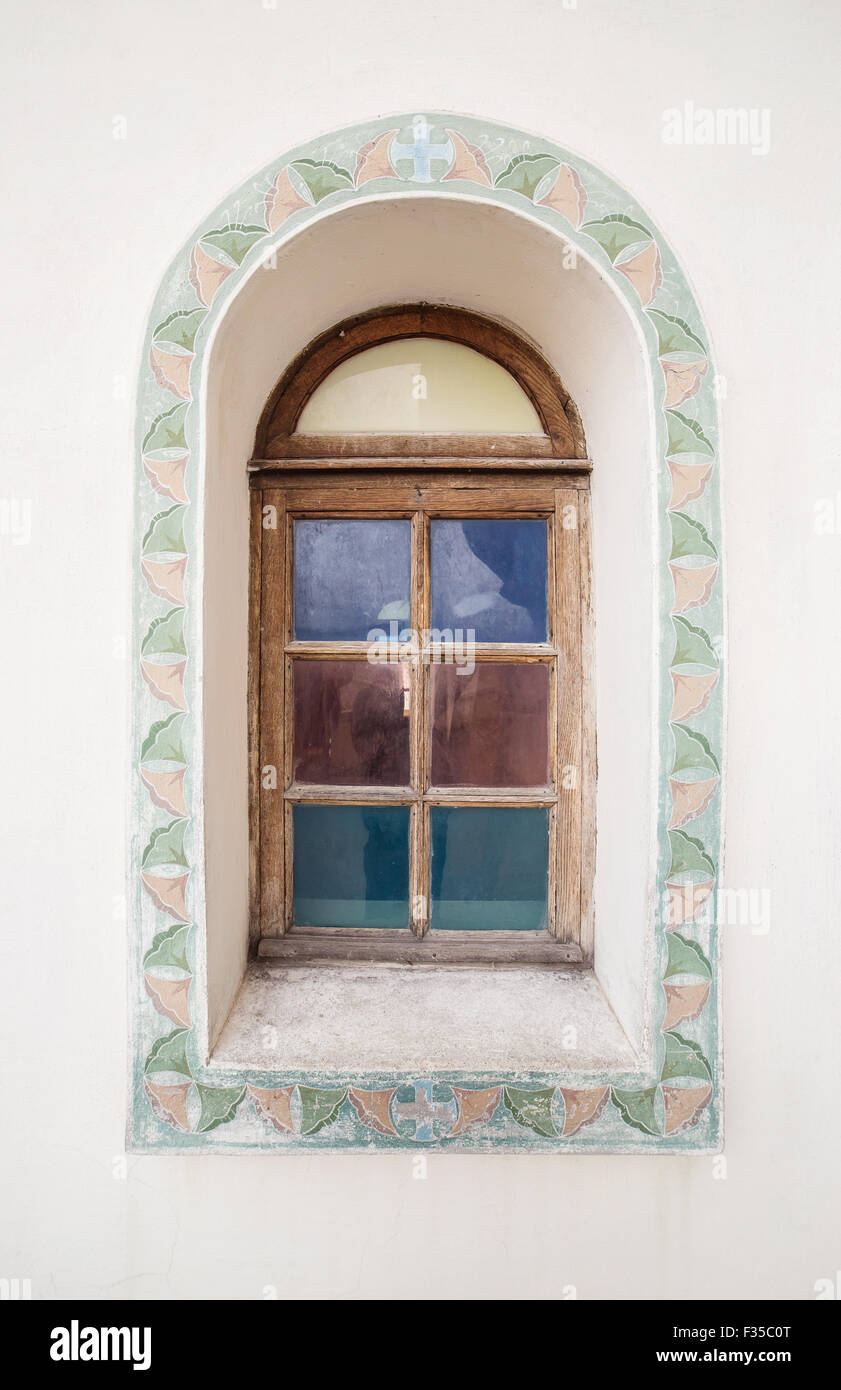 Ancient arc wooden window with ornament Stock Photo