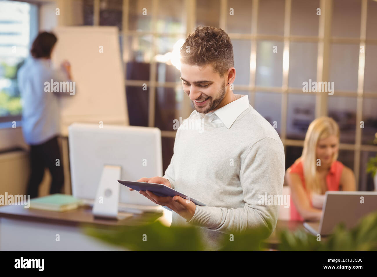 Happy Client Using Computer Happy businessman using digital PC Stock Photo - Alamy
