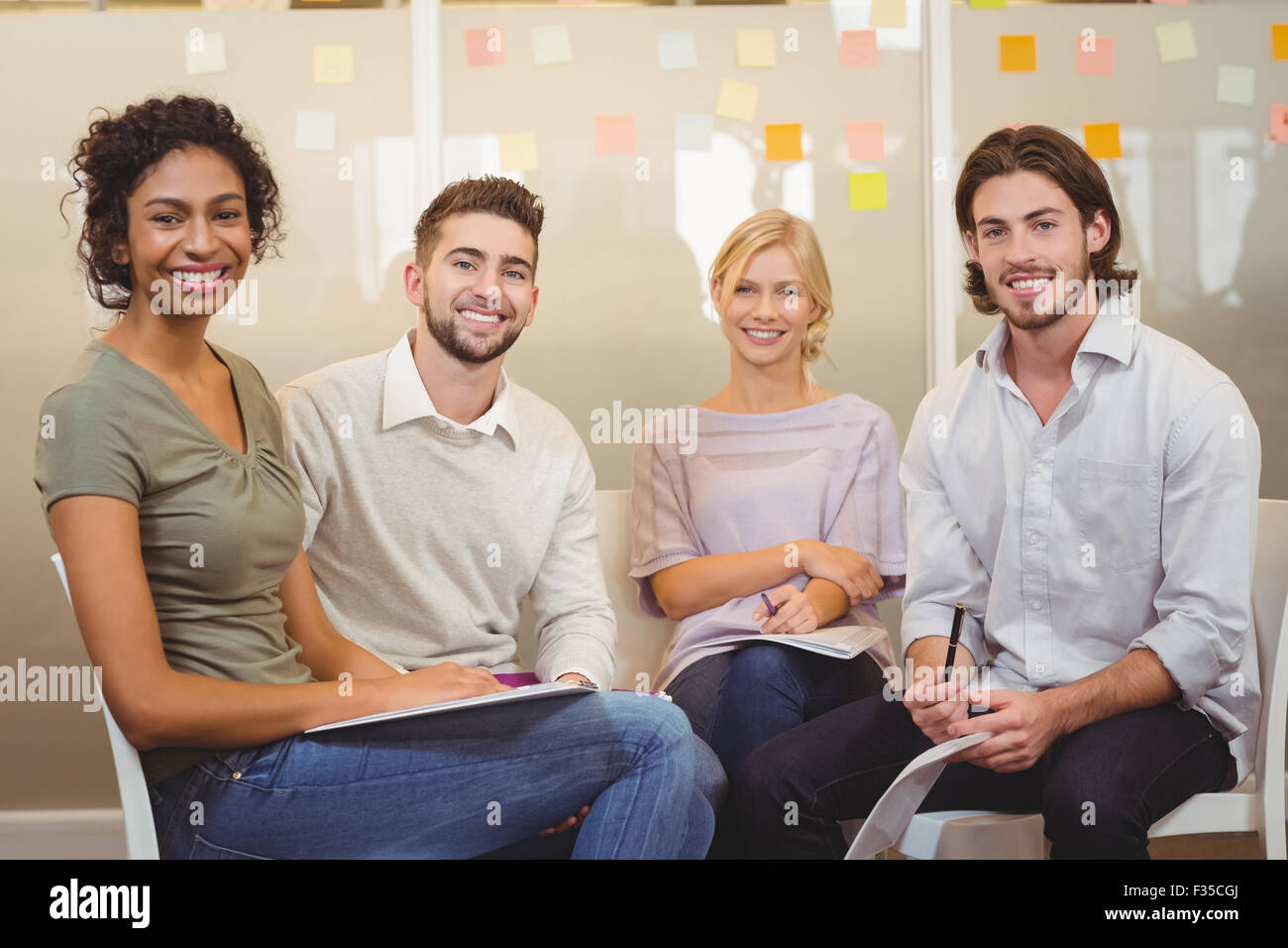 Colleagues interacting with each other Stock Photo