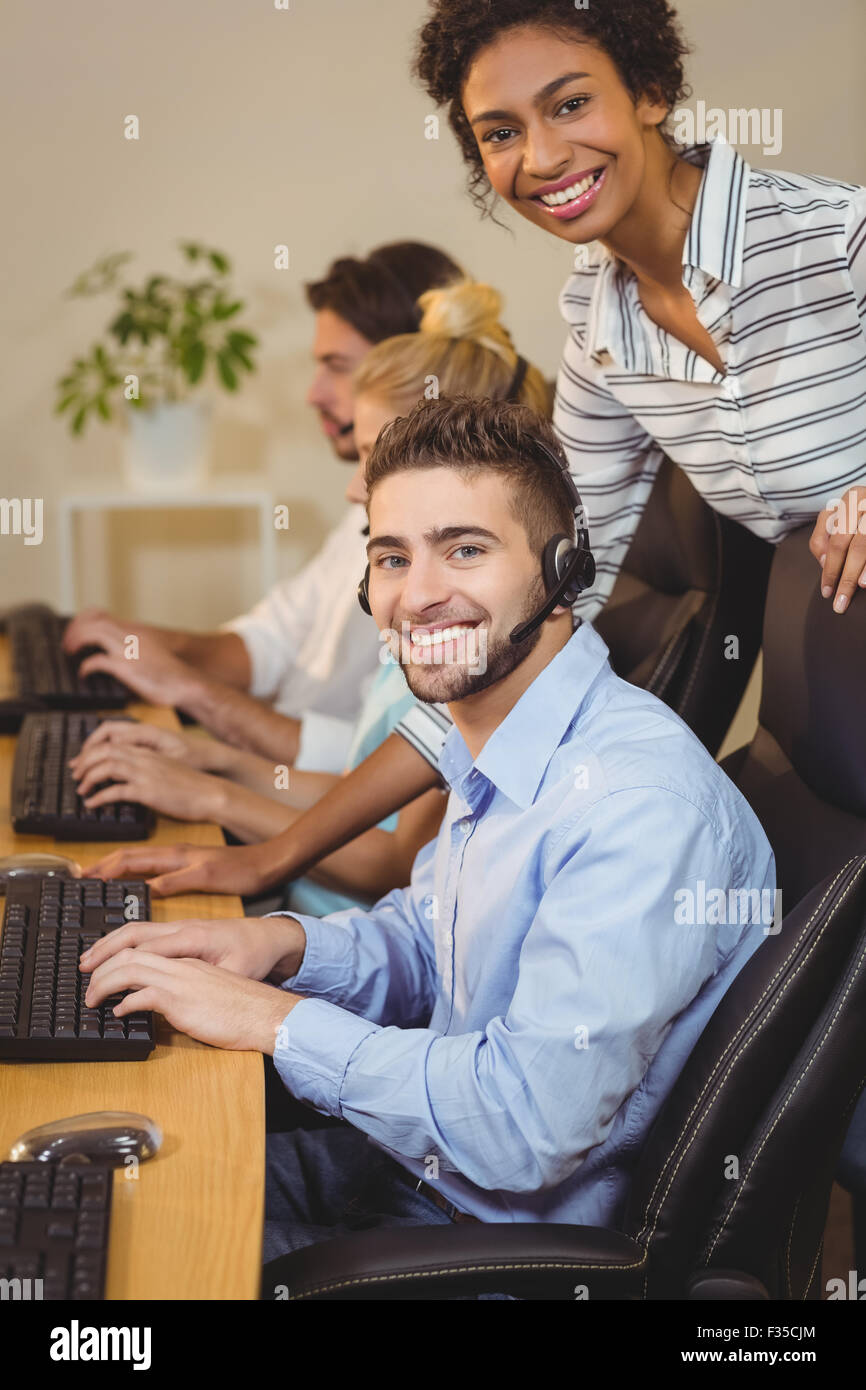 Smiling businesswoman with male employee Stock Photo