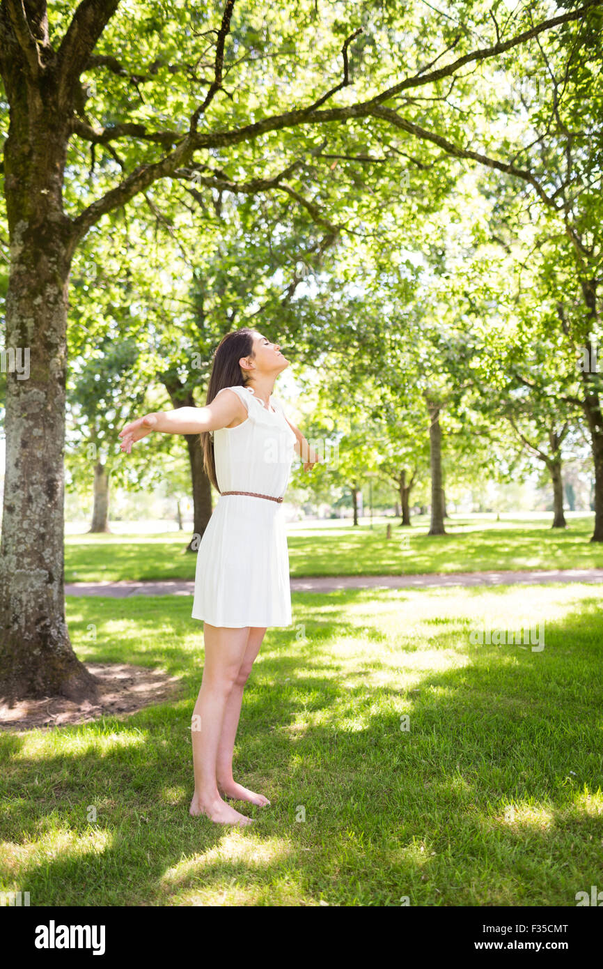 Woman standing in grass hi-res stock photography and images - Alamy