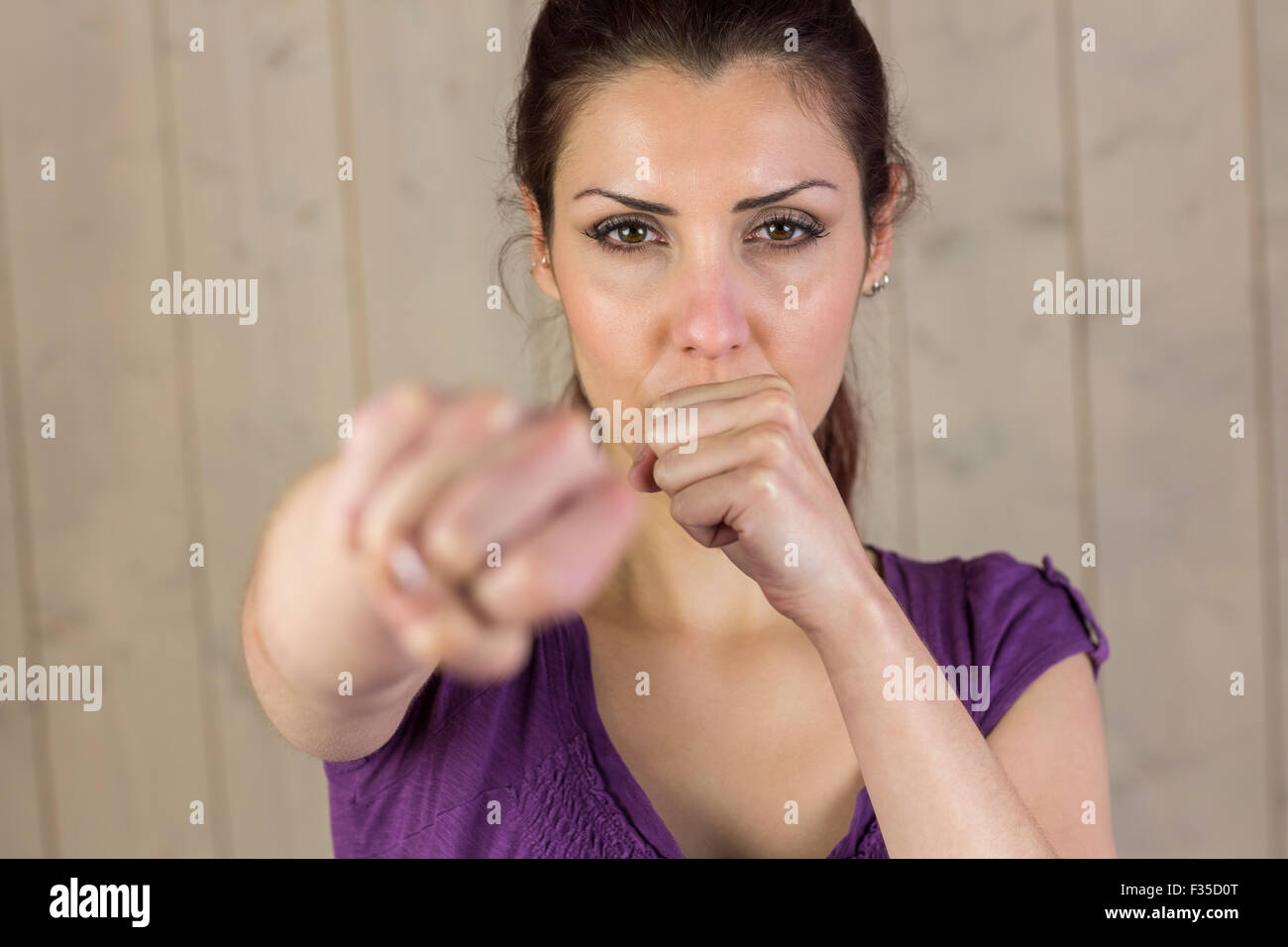 Portrait of beautiful woman punching Stock Photo Alamy