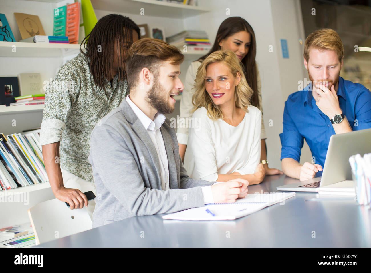 Young people in the office Stock Photo - Alamy
