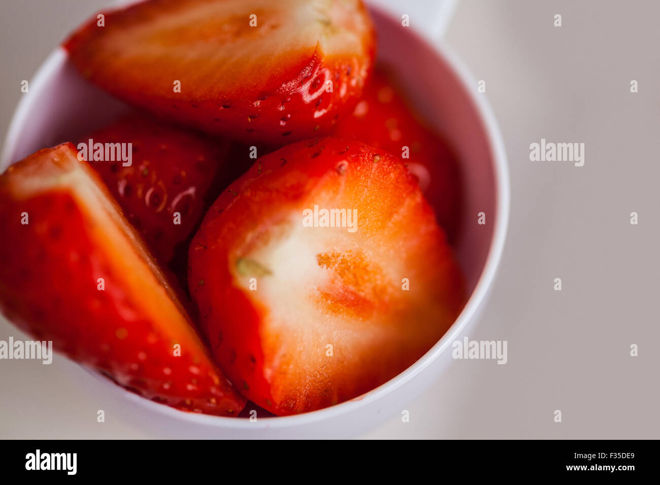 Portion cup of sliced strawberry Stock Photo Alamy