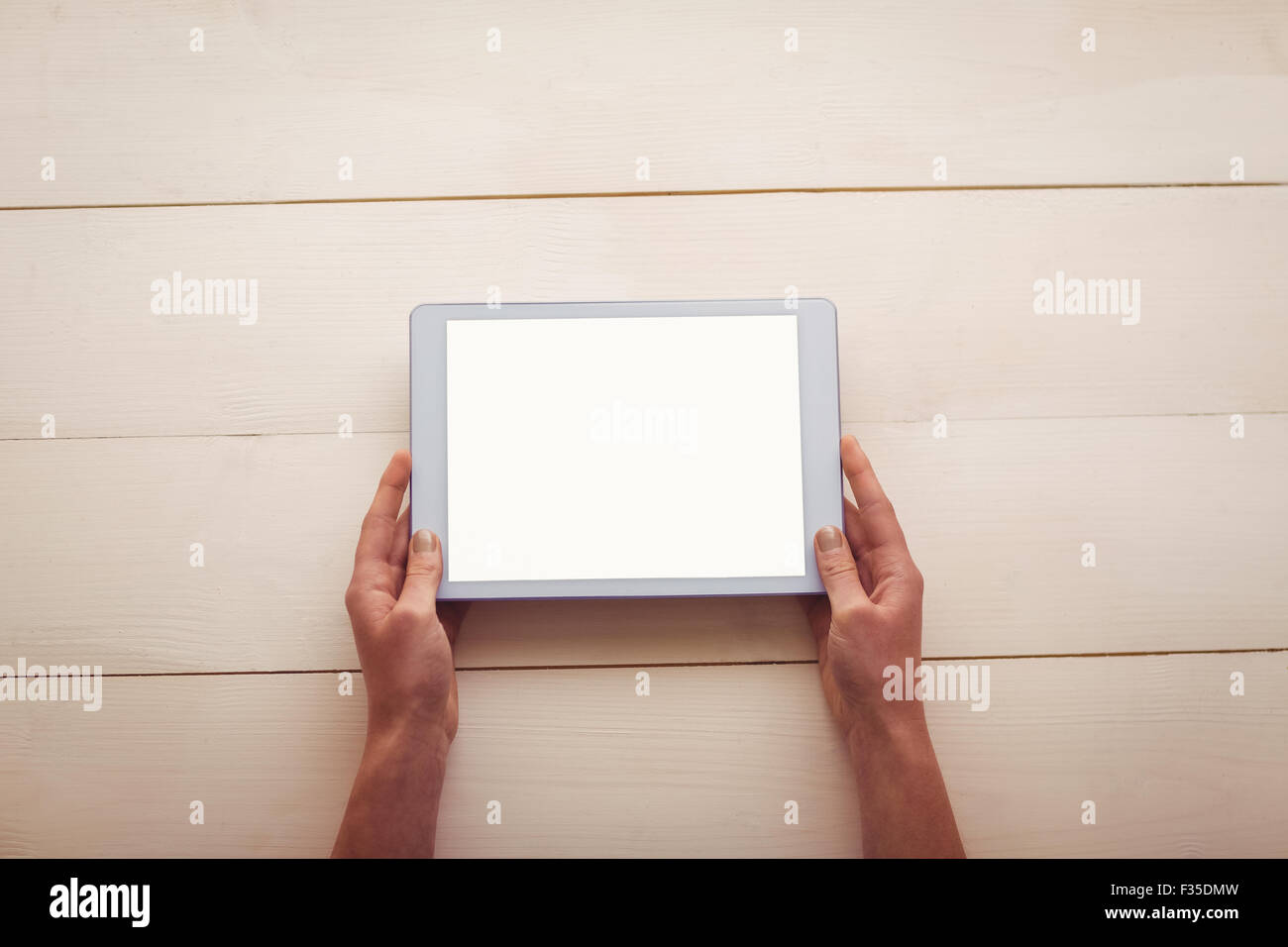 Hands holding blank screen tablet Stock Photo - Alamy