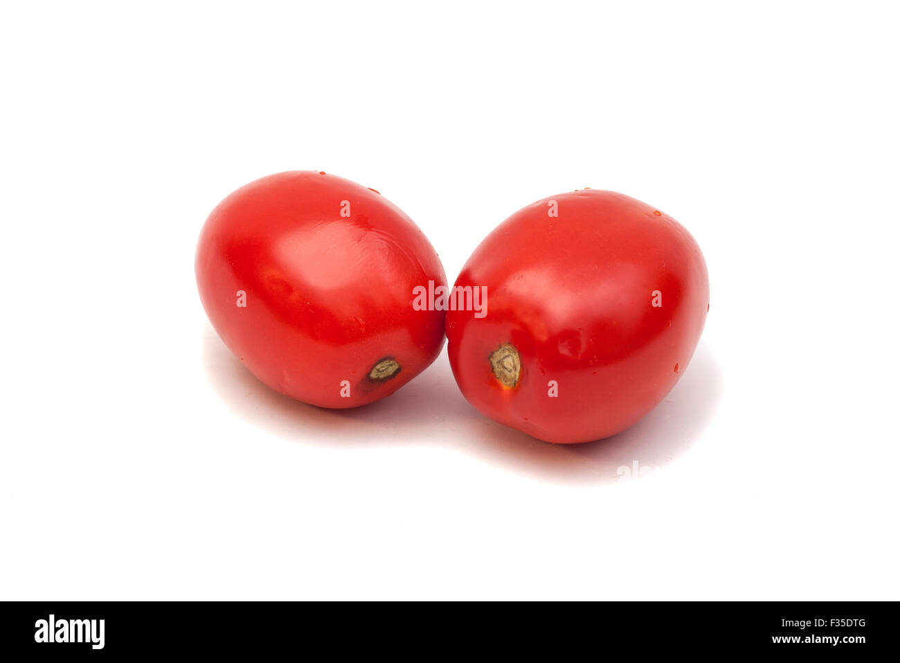 Two red ripe tomatoes isolated on white background Stock Photo - Alamy