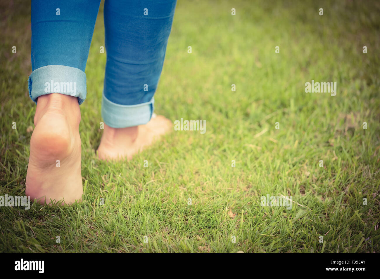 Woman walking barefoot park hi-res stock photography and images - Alamy