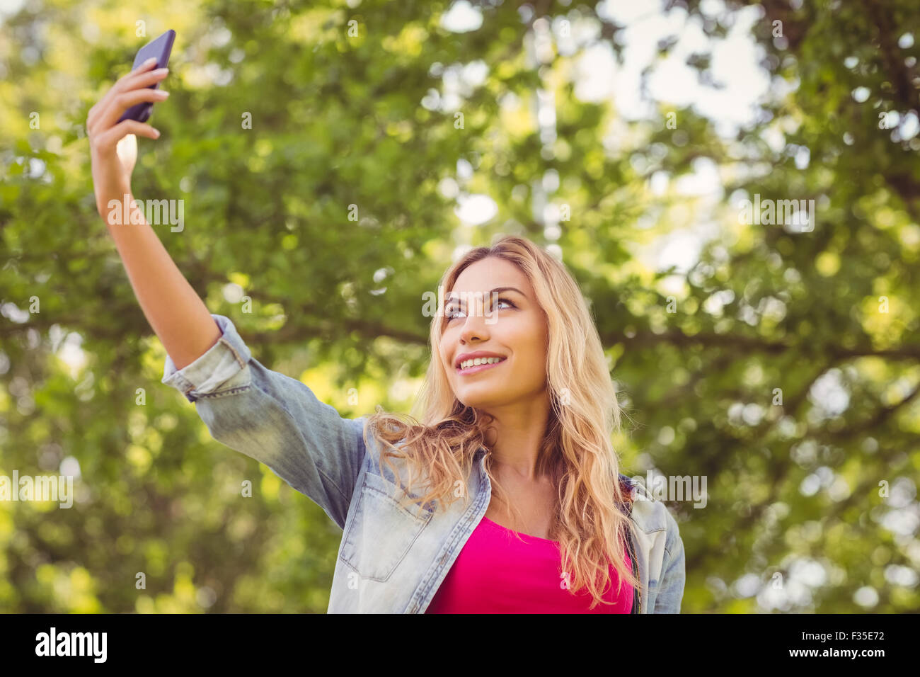 Woman smiling in nature hi-res stock photography and images - Alamy