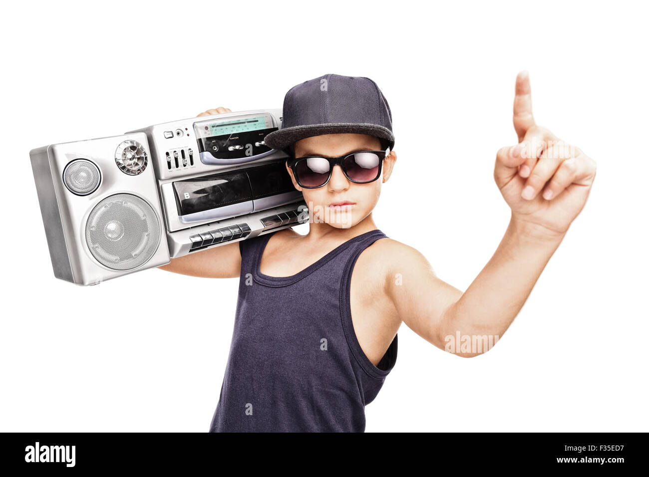 Junior rapper carrying a ghetto blaster and gesturing with his hand isolated on white background Stock Photo