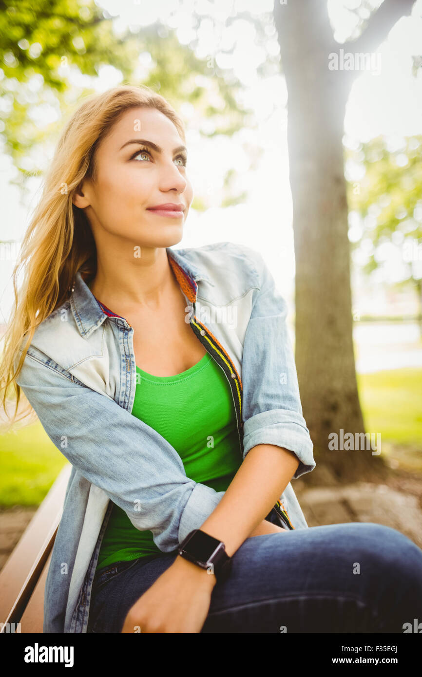 Woman looking away at park Stock Photo - Alamy